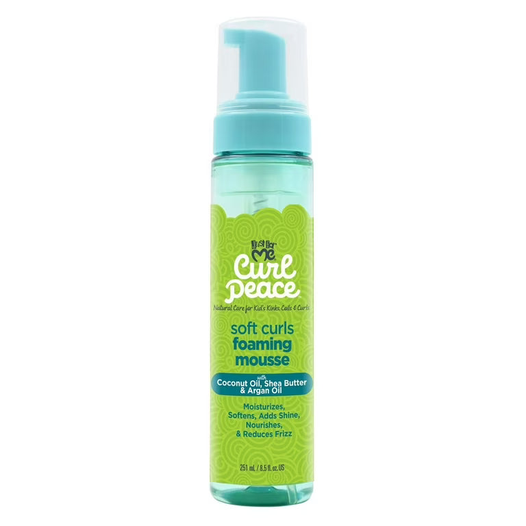 Just For Me's Curl Peace mousse moisturizes softens and adds shine. It also nourishes and reduces frizz. Contains coconut oil shea butter and argan oil.