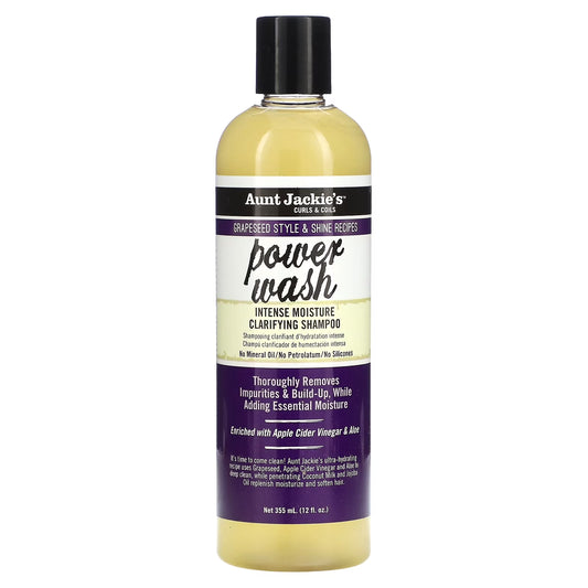 A bottle of Aunt Jackie’s Power Wash Intense Moisture Clarifying Shampoo 12oz standing upright against a plain white background, featuring purple and black packaging with the product name “Power Wash” in large script and “Intense Moisture Clarifying Shampoo” below it.