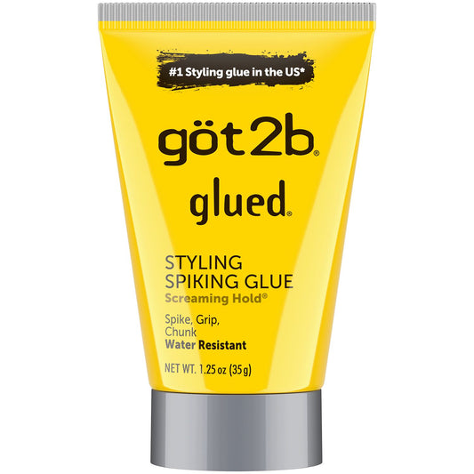A yellow tube with black text of Got2B Glued Styling Spiking Glue that is water resistant for sleek hairstyles
